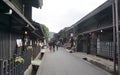 Tourists and local people walking around old town area in Takayama
