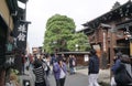 Tourists and local people walking around old town area in Takayama