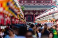 Tourists and locals crowd into Nakamise Dori Street and the Sensoji temple in Tokyo, Japan
