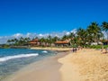 Tourists and locals enjoy Poipu Beach, Kauai Royalty Free Stock Photo