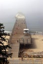 Tourists and locals enjoy the walk on the historic wooden pier at Seacliff State Beach.