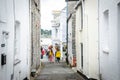 Beautiful buildings in Padstow, Cornwall, UK with people walking around