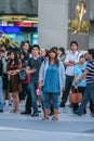 Tourists and locals watching the live broadcast on the screen on the street of wedding of Prince William and Kate Middleton. Royalty Free Stock Photo