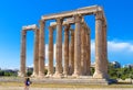 Tourists look at Olympian Zeus temple in Athens, Greece