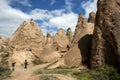 Tourists look over the magnificent landscape of the Devrent Valley in the Cappadocia region of Turkey.