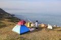 Tourists look at the sea by the tent, adobe rgb