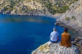 Tourists look from the top to the sea