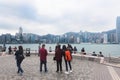 Tourists look at Victoria Harbour, Hong Kong