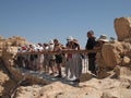 Tourists looking at the desert of Masada Israel