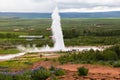 Tourists are looking eruption of Strokkur Geyser, Iceland Royalty Free Stock Photo