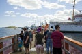 Tourists looking at Halifax Port Coastline from Transport Ferry to Nova Scotia capital City