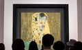 Tourists looking at The Kiss by Gustav Klimt, Vienna