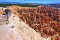 Tourists looking at the panorama at the Inspiration Point Lookout in the Bryce Canyon National Park. Utah USA Royalty Free Stock Photo