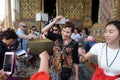 Tourists with lotus flower bathed in holy water  Grand Palace  Bangkok  Thailand Royalty Free Stock Photo