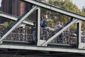 Tourists and Lovelocks on the Eiserner Steg, Bridge in Frankfurt, Germany