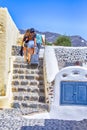 Tourists with Luggage Travelling on Santorini Island in Greece