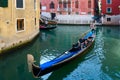 Tourists make gondola ride on canals of Venice, Italy Royalty Free Stock Photo