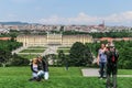 Tourists make photo on the background Schonbrunn Palace, Vienna