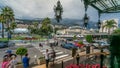 Tourists make pictures near expensive cars and famous Casino building timelapse in Monte Carlo in Monaco.