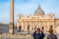 Tourists making photos of St. Peter`s Basilica in Vatican, Rome, Italy Royalty Free Stock Photo