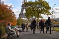 Tourists making photos in Trocadero site in an autumn day