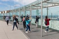 Tourists making pictures from Montparnasse tower in Paris, France