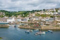Tourists in Mevagissey Harbour, Cornwall, England Royalty Free Stock Photo