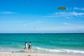 Tourists in Miami Beach and advertising for Firearms Museum Royalty Free Stock Photo