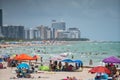 Tourists on Miami Beach. Getting ready for a day at the beach