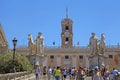 Tourists on Michelangelo stairs to Capitoline Hill and Senatorial Palace, Rome, Italy. Royalty Free Stock Photo