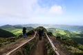 Tourists at the Miradouro da Grota do Inferno viewpoint in Sao Miguel Island, Azores, Portugal