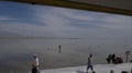 Tourists & monks visiting the China Caka salt lake