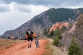 Tourists mountain biking in Colorado Red Rocks Open Space park