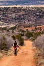 Tourists mountain biking in Colorado Red Rocks Open Space park