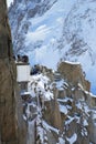 Tourists at the mountain top station of the Aiguille du Midi 3842 m in French Alps watching climbers exercise