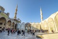 Tourists, Muslim worshipers, and visitors visit the interior square inside the Blue Mosque in the Sultanahmet district of Istanbul