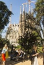 Tourists at Nativity facade of La Sagrada Familia - the impressive cathedral designed by Gaudi. Barcelona, Spain Royalty Free Stock Photo