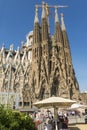 Tourists at Nativity facade of La Sagrada Familia - the impressive cathedral designed by Gaudi. Barcelona, Spain Royalty Free Stock Photo