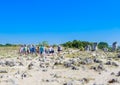 Tourists in the natural phenomenon Pobiti Kamani Royalty Free Stock Photo