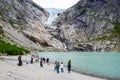 Tourists near the Briksdalsbreen glacier in Norway