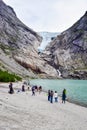 Tourists near the Brikdalsbreen glacier in Norway