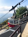 Tourists near cabin of aerial lift on Mashuk mount Royalty Free Stock Photo