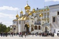 Tourists near the Cathedral of the Annunciation of the Moscow Kremlin