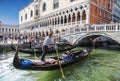 Tourists near the Doge`s Palace, in gondolas in the Palace canal and on Straw bridge, Venice,