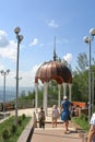 Tourists near gazebo with white columns and a copper dome Royalty Free Stock Photo