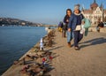 Tourists near Iron shoes memorial to Jewish people executed during WW2 in Budapest