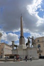 Tourists near the obelisk in Piazza del Quirinale in Rome