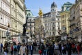 Tourists near Plague column Holy Trinity Column on Graben street in Vienna city in springtime