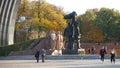 Tourists near the sculptural composition Friendship of Peoples on an autumn day