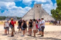 Tourists next to the Pyramid of Kukulkan at Chichen Itza in Mexico Royalty Free Stock Photo